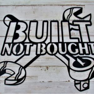 Metal sign with the words Built Not Bought overlaying two crossed wrenches