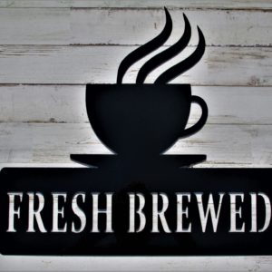 black metal sign of cup of coffee with steam rising sitting on a saucer above the words Fresh Brewed in all caps