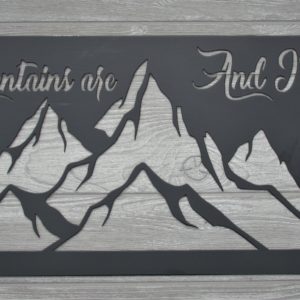 Metal sign of mountains with the words Mountains Are Calling and I Must Go