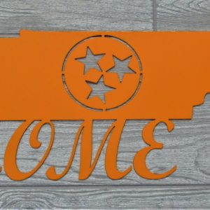 Orange metal sign of the state of Tennessee with the tri-stars in the center and the word Home below