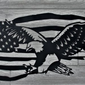 Black metal sign of flying eagle with the American flag in the background