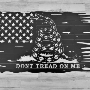 Laser cut metal sign of a tattered America flag in all black with a rattlesnake in the center and the words Don't Tread On Me bottom centered