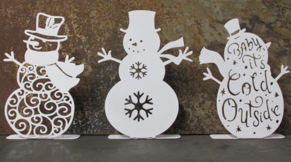 Three white laser cut metal snowmen